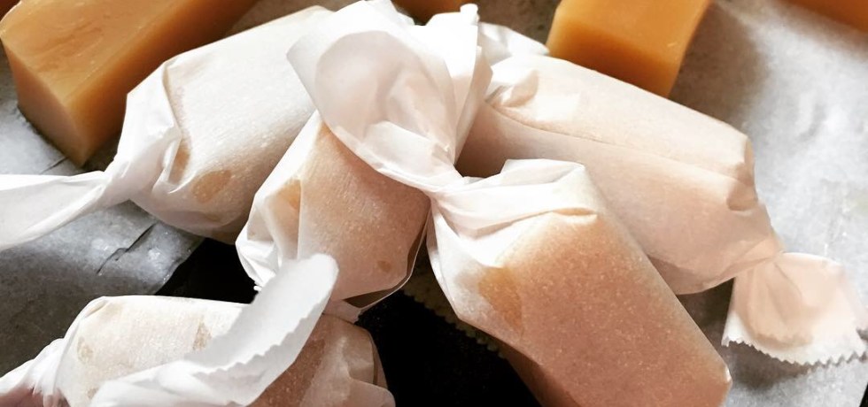 Salted Vanilla Caramel Candies wrapped in parchment paper