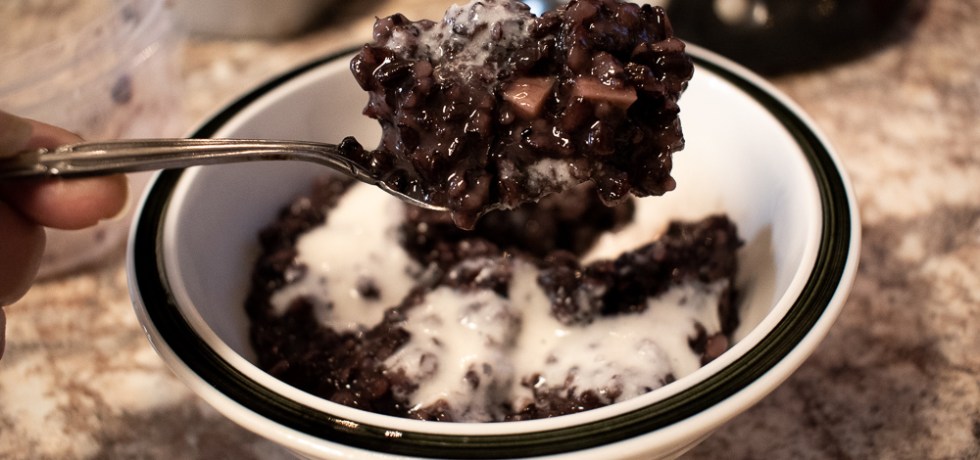 Thai black sticky rice pudding with coconut cream and taro root