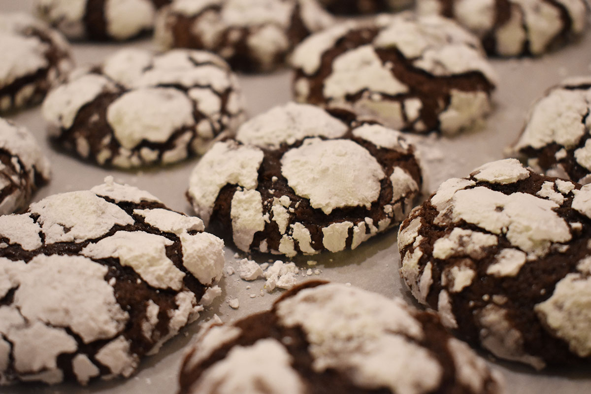 Chewy Chocolate Brownie Crinkle Cookies covered in powdered sugar