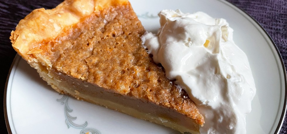 apple cider pie slice with fresh whip cream
