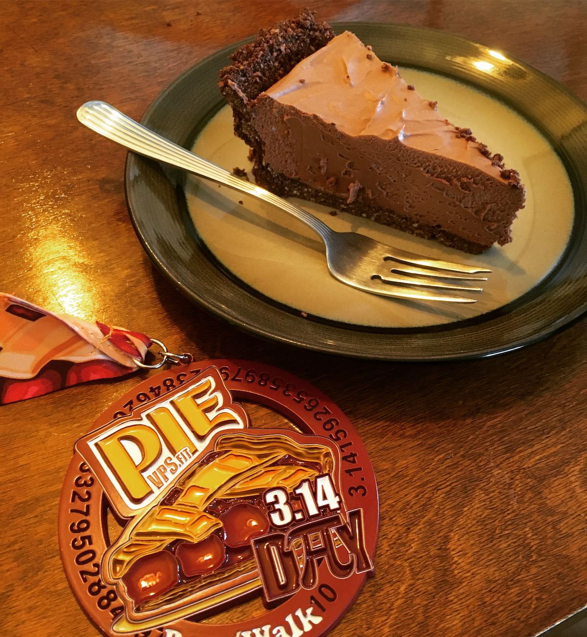 slice of french silk pie along with pie day half marathon medal